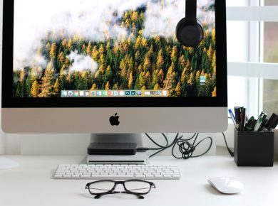 Free Stylish home office workspace featuring a computer setup with accessories. Stock Photo