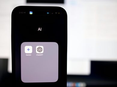 a close up of a cell phone with an ai button