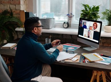 teacher-video-calling-with-his-students-using-a-computer
