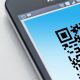 Free High-resolution close-up of a smartphone displaying a QR code on its screen. Stock Photo